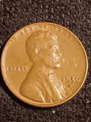 1956 wheat penny off-center strike error showing partial design and blank crescent area